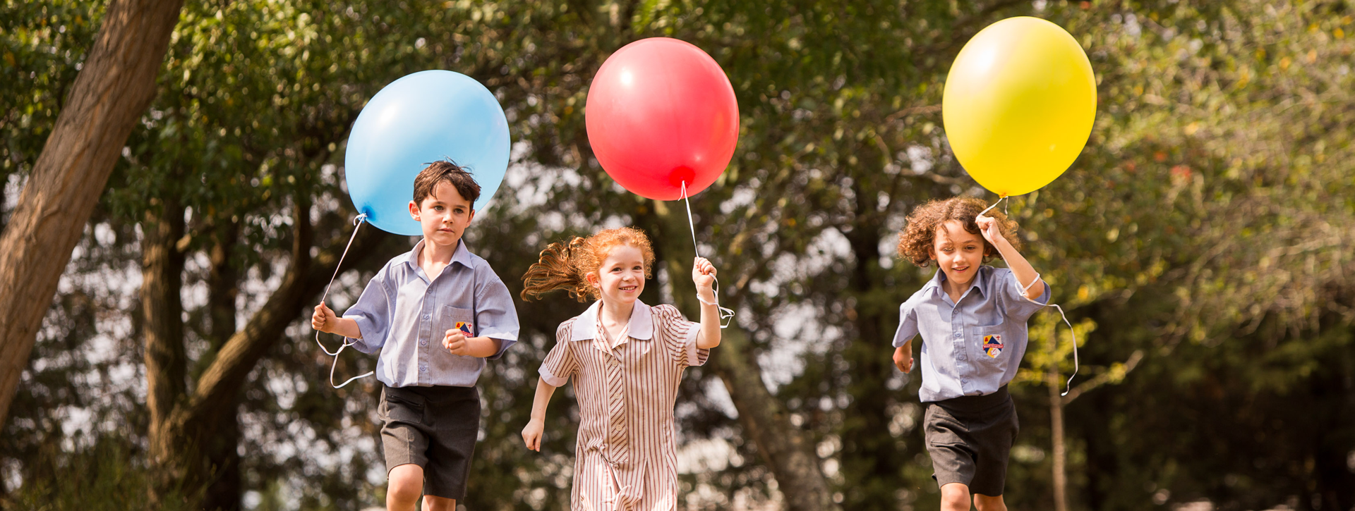 Children Running with Balloons