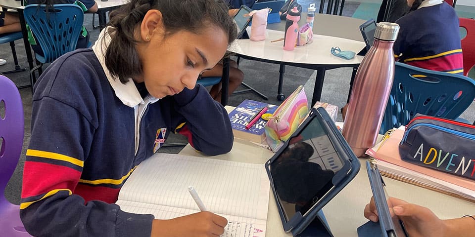 Girl Writing on the Paper