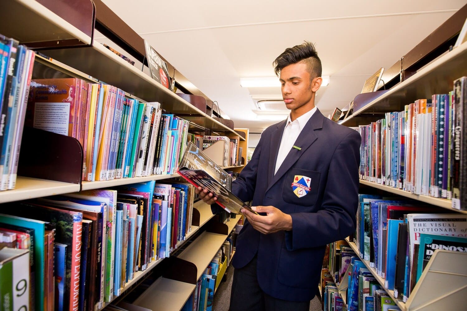 Student Read a Book in the Library