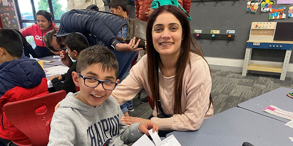 Mother and Son Smiling at Camera